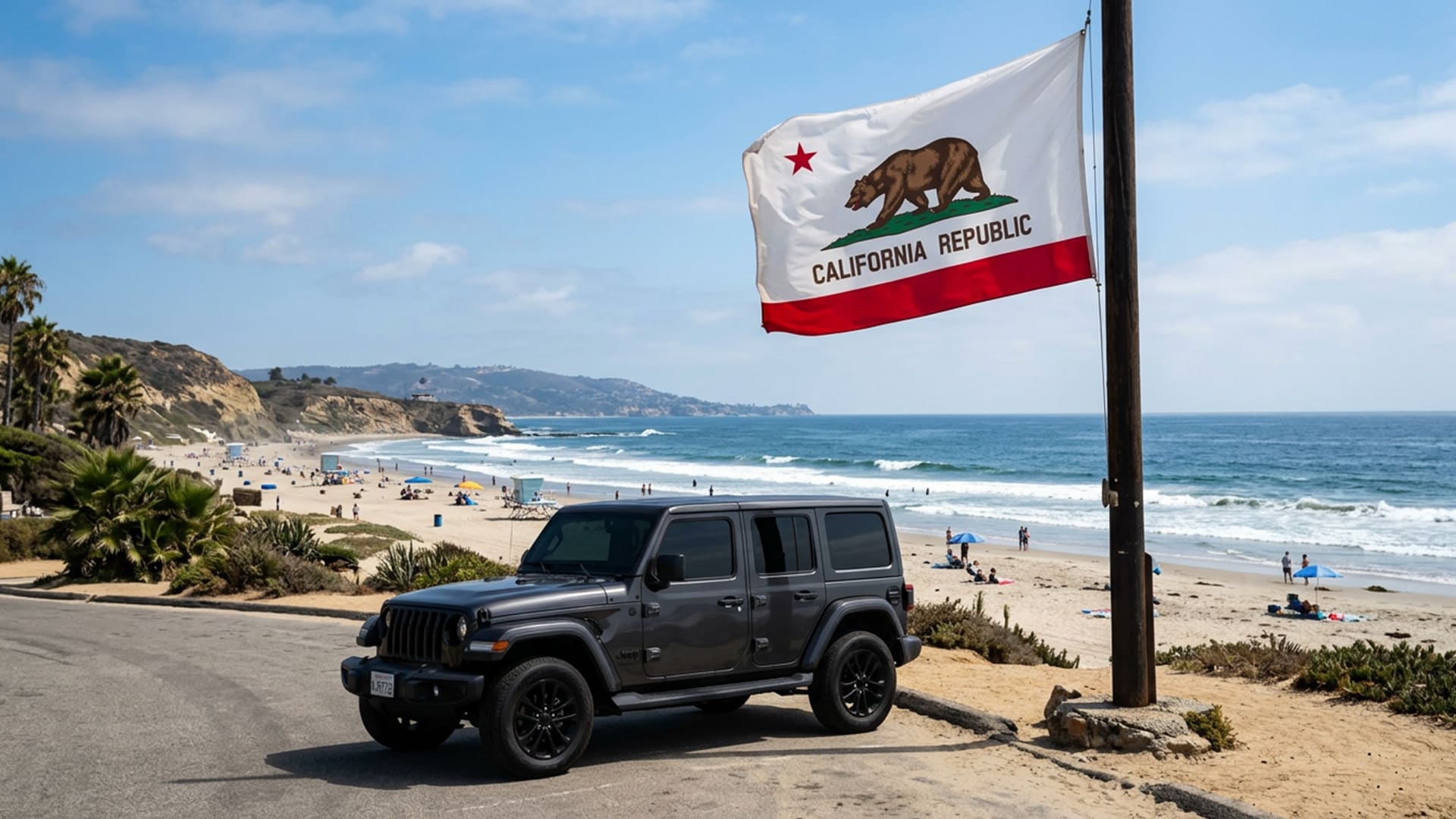 california state flag with a car with tinted windows near the beach